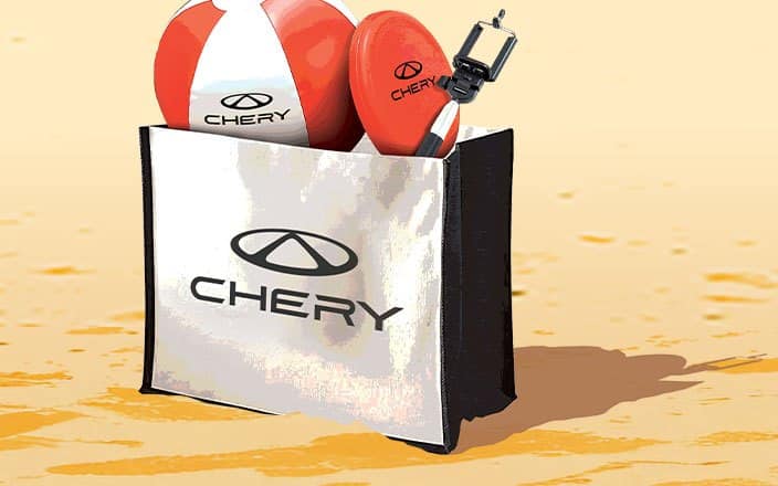 The free Chery Summer Pack — a branded beach bag with a beach ball and frisbee