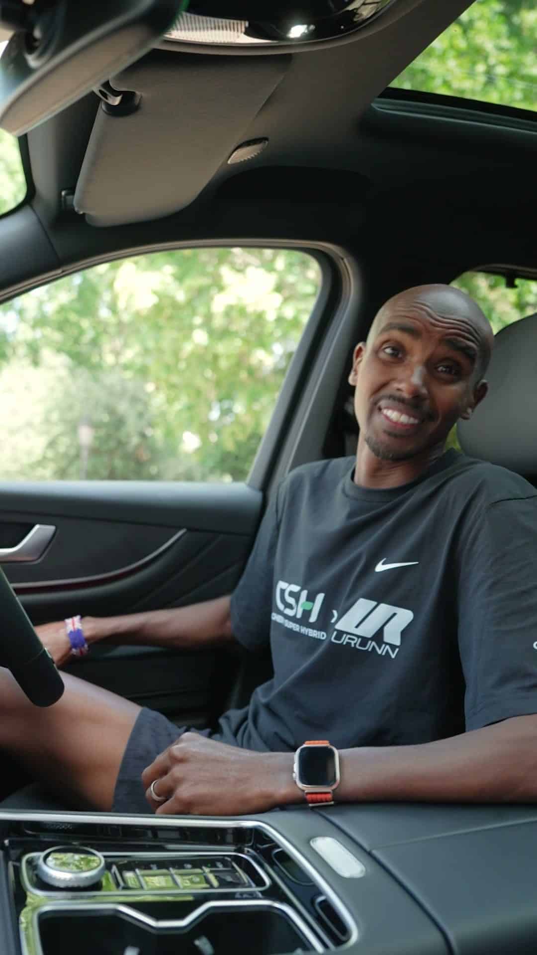 Sir Mo Farah behind the wheel of a Chery