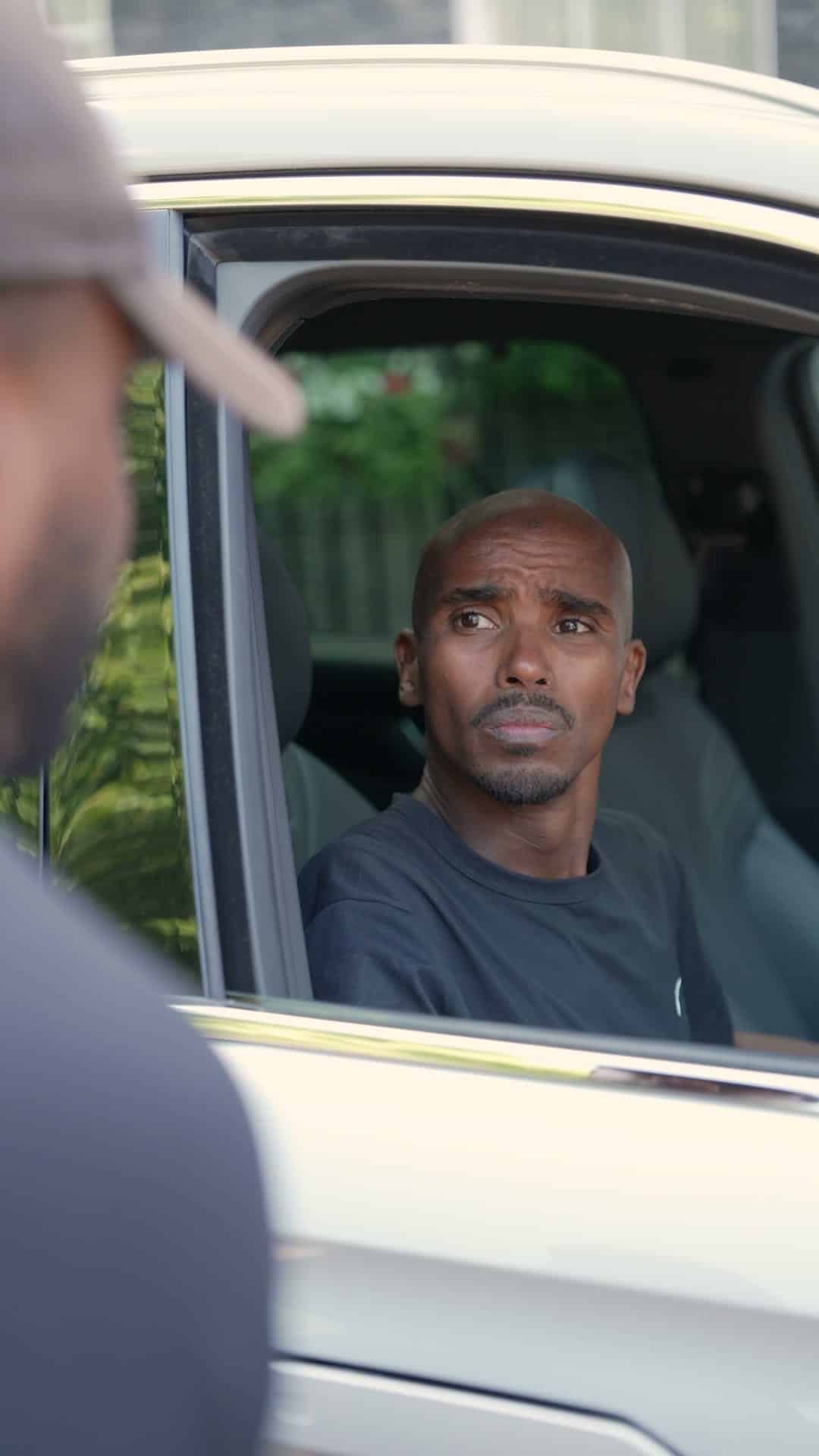 Sir Mo Farah looking out of a Chery window